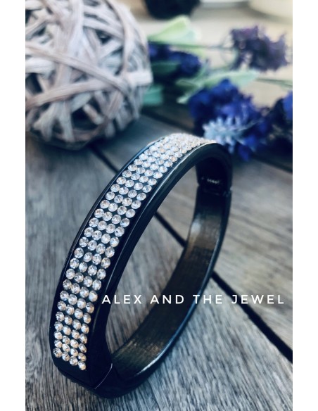 Βραχιόλι χειροπέδα από ατσάλι σε μαύρο χρώμα με καρφωτά ζιργκόν σε λευκό Milva