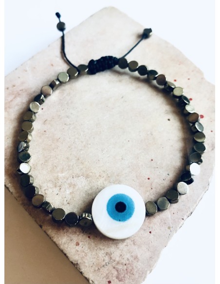 Χειροποίητο βραχιόλι σε μαύρο ή χρυσό με πέτρες αιματίτη και στοιχείο μάτι από φίλντισι σε λευκό και γαλάζιο  Mata Χειροποίητο βραχιόλι σε μαύρο ή χρυσό με πέτρες αιματίτη και στοιχείο μάτι από φίλντισι σε λευκό και γαλάζιο  Mata