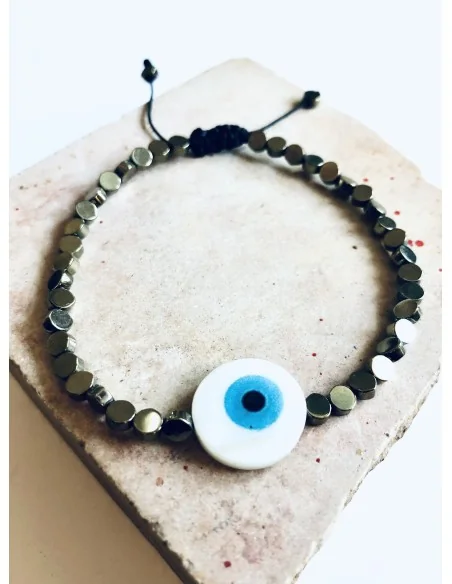 Χειροποίητο βραχιόλι σε μαύρο ή χρυσό με πέτρες αιματίτη και στοιχείο μάτι από φίλντισι σε λευκό και γαλάζιο Mata