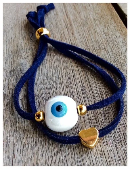 Χειροποίητο βραχιόλι μάτι σε λευκό και γαλάζιο σε μπλε σουέτ κορδόνι με διακοσμητικά επίχρυσα στοιχεία και αυξομείωση Bleu